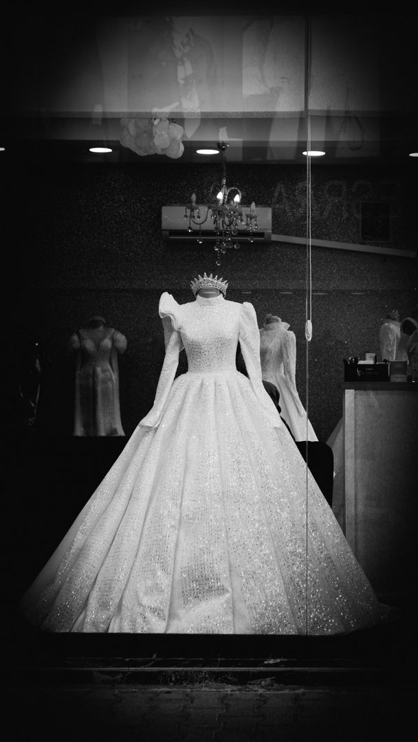 elegant wedding dress display in boutique Licensed inspiration image; not a BMG client portfolio claim.