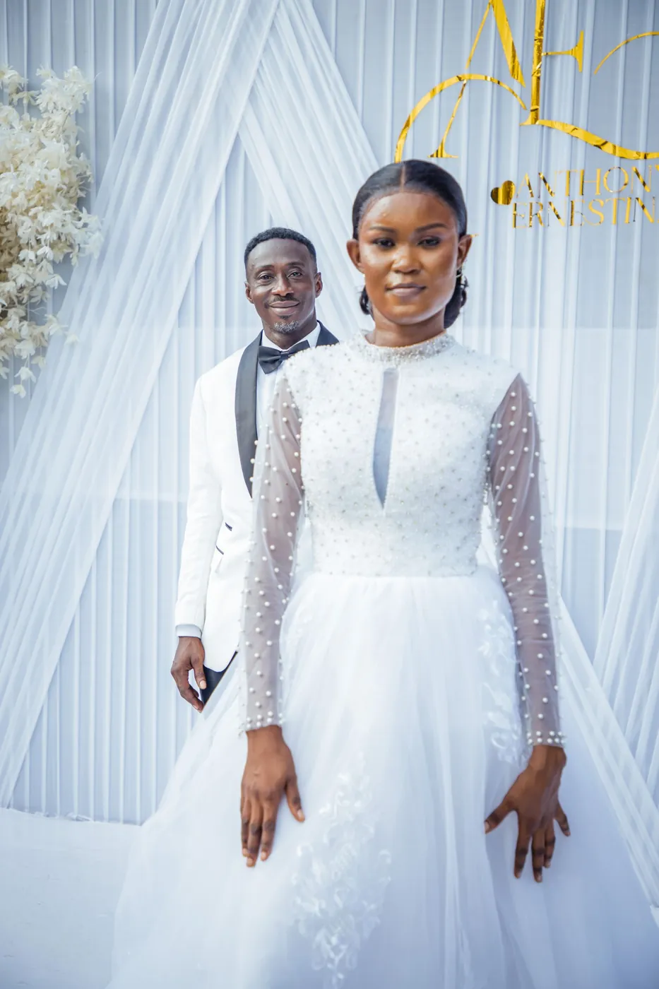 Beautiful portrait of a bride and groom in elegant attire at a wedding ceremony. Licensed inspiration image; not a BMG client portfolio claim.
